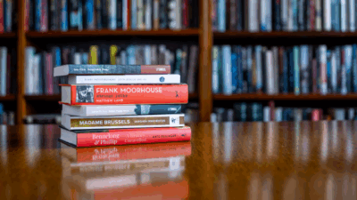 A book stack of the shortlisted titles for the National Biography Award